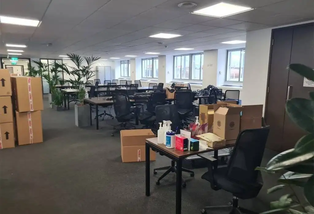 there is a process of removing the office and there is all the things are packed and ready for loading in removing trucks