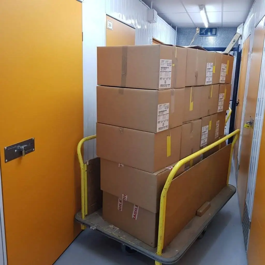this is a pic of packed luggage in the trolley outside the storage unit