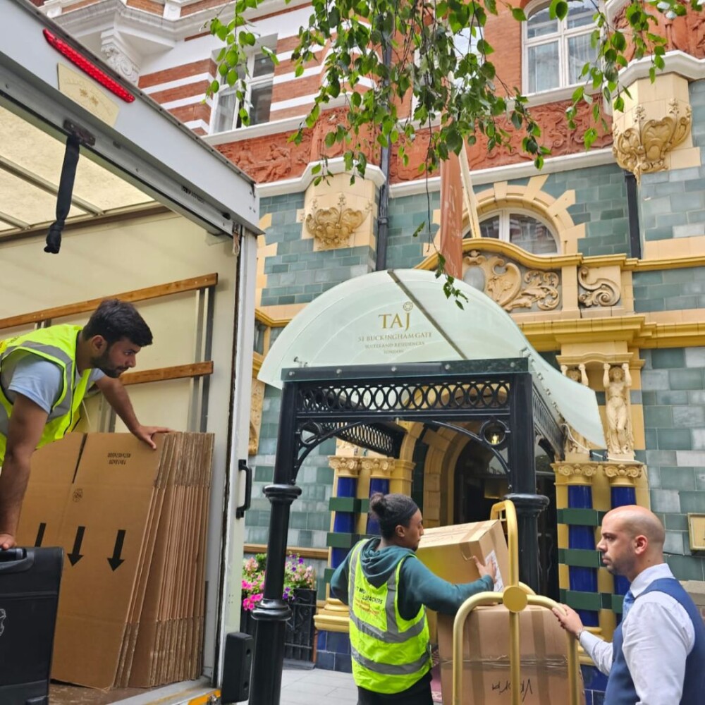 Team from 24/7 Movers Packers London handling office and furniture removals outside a commercial building in Central London.